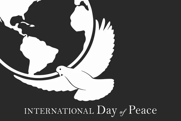 International Day of Peace. White bird on a dark background close up.