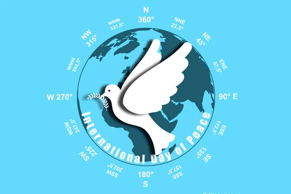 International Day of Peace. White dove on the background of the planet earth close up.