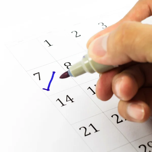 Blue check. Mark on the calendar at 7. — Stock Photo, Image