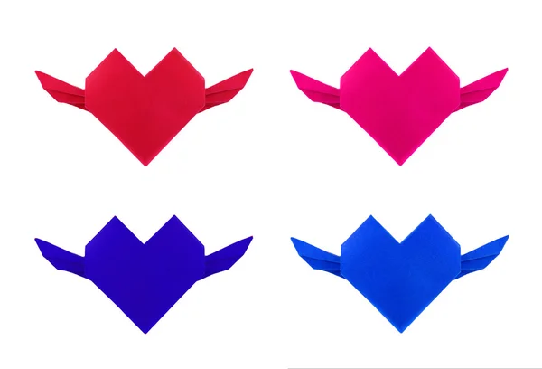 Origami corazón de papel de cuatro colores con columpio sobre fondo blanco — Foto de Stock