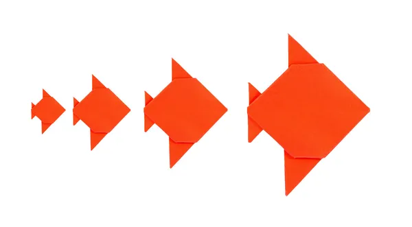 Four orange fish origami from paper on white background — Stock Photo, Image