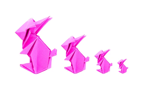 Čtyři růžový králík origami z papíru na bílém pozadí — Stock fotografie