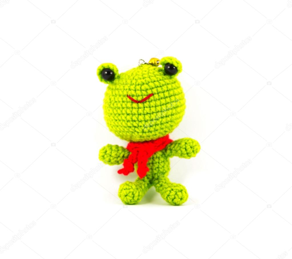handmade crochet green frog doll on white background