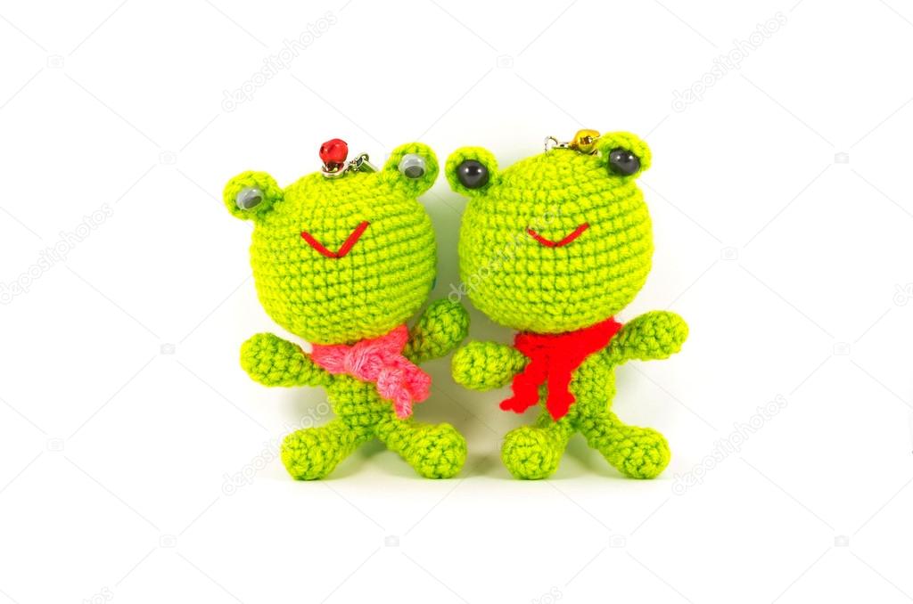 handmade crochet two green frog doll on white background