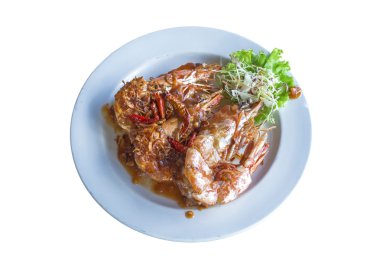 Beyaz adam tabağa demirhindi soslu kızarmış karides