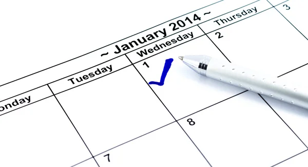 Verificação azul. Marcar no calendário em 1St Janeiro 2014 com caneta, n — Fotografia de Stock