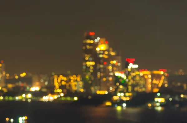 Paisagem urbana de Pattaya à noite, foto borrada bokeh — Fotografia de Stock