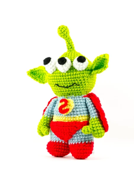 Handmade crochet green alien three eyes super hero doll on white — Stock Photo, Image