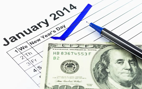 Blue check. Mark on the calendar at 1St January 2014 with usd m — Stock Photo, Image