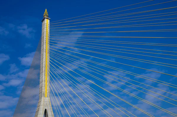 Fragment of a cable stayed bridge on blue the sky background. — Stock Photo, Image