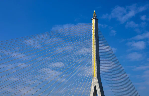 Fragment of a cable stayed bridge on blue the sky background. — Stock Photo, Image