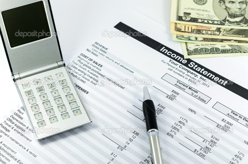 income statement report with calculator, pen and usd money for b
