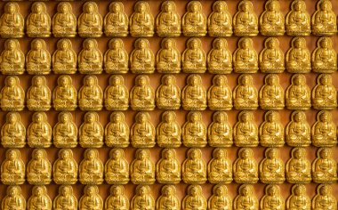 ten thousand golden buddhas lined up along the wall of chinese t clipart