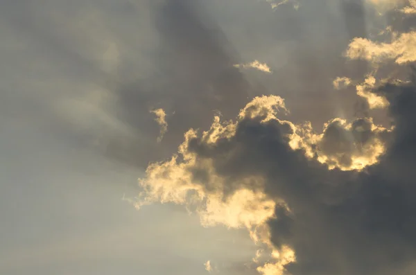 Clouds on the sky with sun ray on worm white balance — Stock Photo, Image