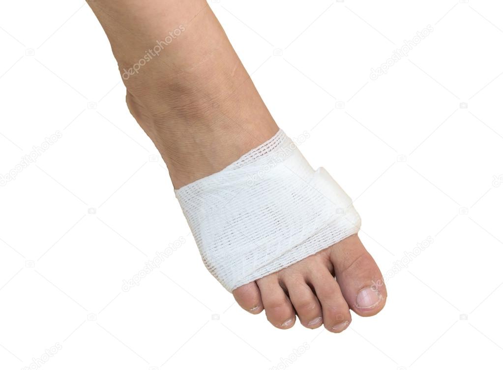 White medicine bandage on injury foot with white background, iso