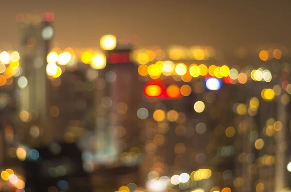 Cityscape achtergrond, wazig foto bokeh met warme kleur — Stockfoto