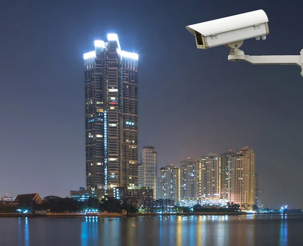 Security camera monitoring the cityscape river view at twilight — Stock Photo, Image