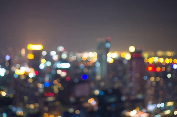 Cityscape bokeh, foto borrada, paisagem urbana no crepúsculo tempo — Fotografia de Stock