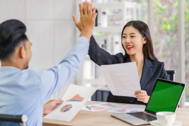 Boss congratulating by give me five action to asian businesswoman in glad action when successful project or getting promote, rewarding the business target in modern office, Success business concept, 