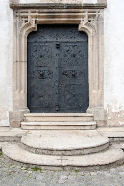 Old ancient entrance door made of iron — Stock Photo, Image