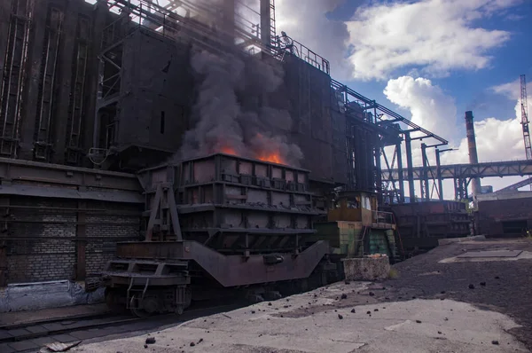 coke and chemicals plant.unloading of hot coke and from the furnace to a coke oven truck