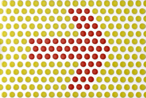 Arrow symbol on the tile with round red and yellow — Stock Photo, Image