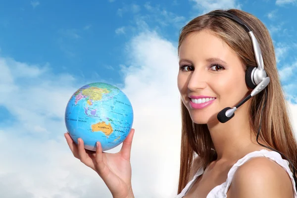 Receptionist with headphones and globe — Stock Photo, Image