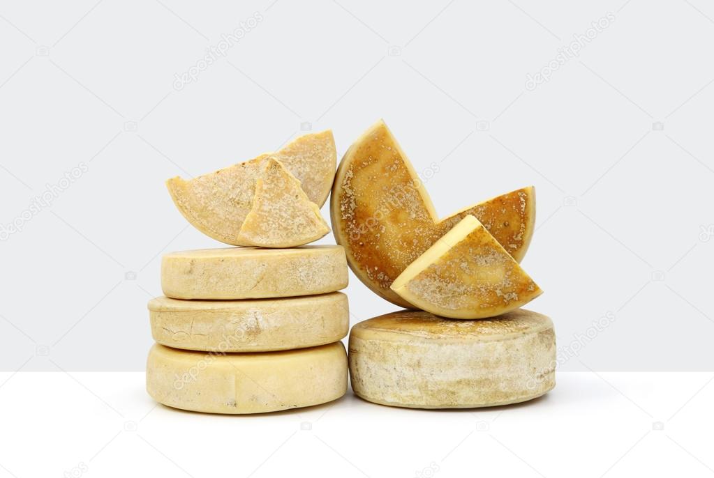 various forms of cheese on white background 