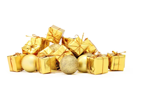 Christmas decorations packages and golden balls — Stock Photo, Image