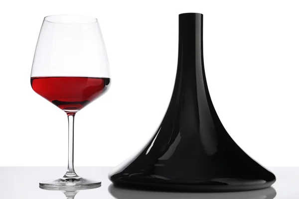 Glass and bottle of red wine decanter — Stock Photo, Image