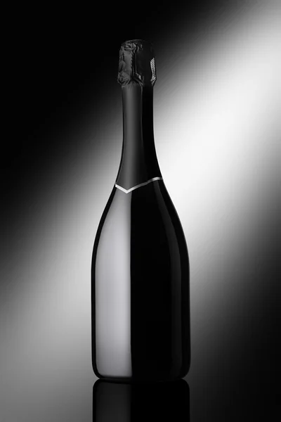 bottle of sparkling wine on a black background