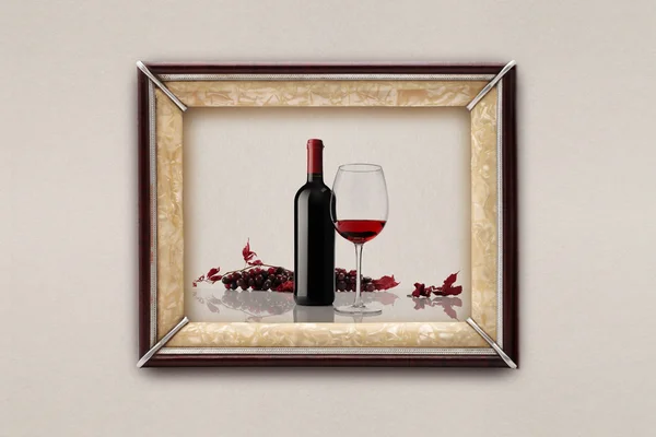 Bottle and glass of wine in the frame on the wall — Stock Photo, Image