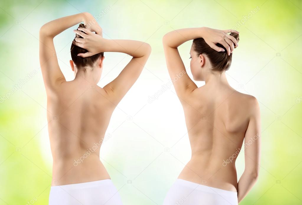 Body of woman ass and back on green background