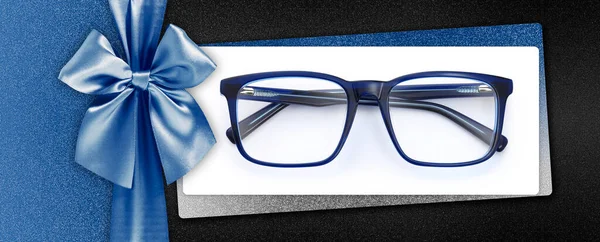 Glasses Christmas Gift Card Shiny Blue Ribbon Bow Isolated Glittering — Stock Photo, Image