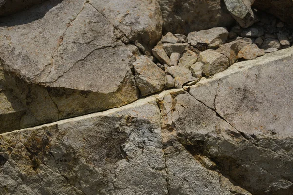 Çeşitli doğal kalıplara sahip doğal taş dokusu. Resimler duvar kağıdı, arkaplan resimleri veya grafik kaynakları olarak kullanmak için uygundur