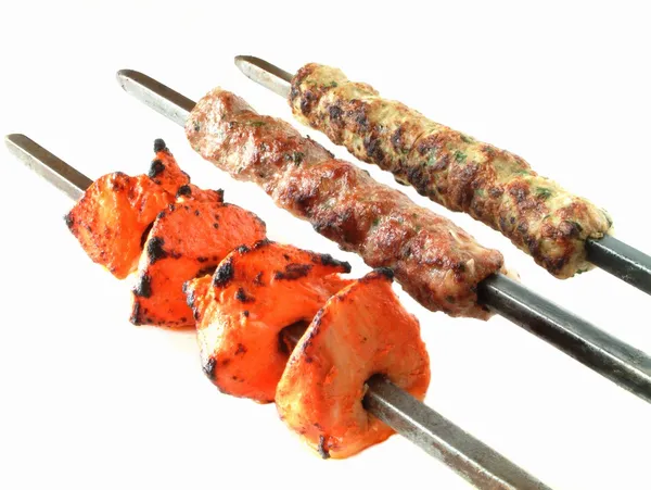 Kofta shish and tikka kebabs on white — Stock Photo, Image