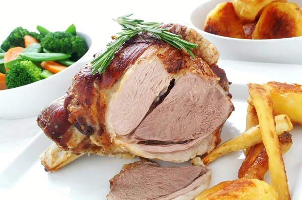 Roast leg of lamb with vegetables — Stock Photo, Image