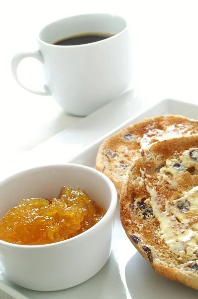 Bettered toasted tea cakes with marmalade and coffee — Stock Photo, Image