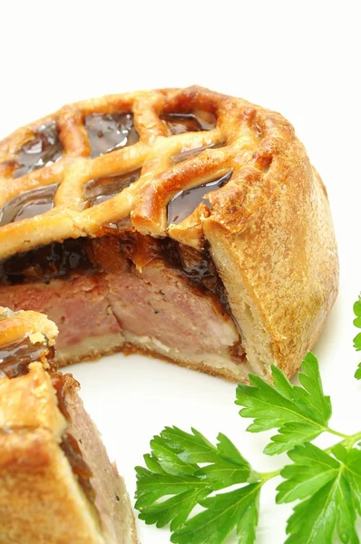 Traditional pork pie on white platter — Stock Photo, Image
