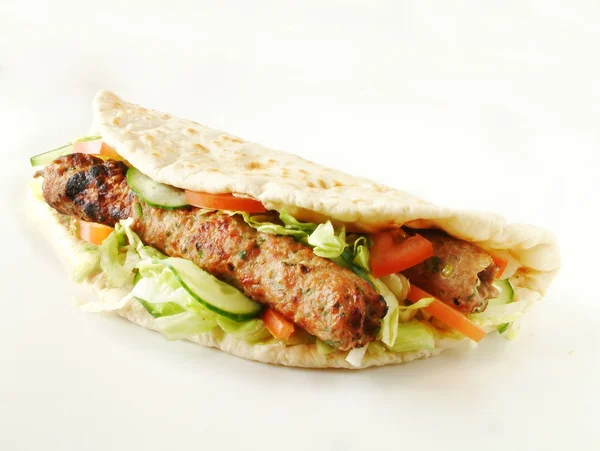 Shish indio kofta kebab envuelto en pan naan —  Fotos de Stock