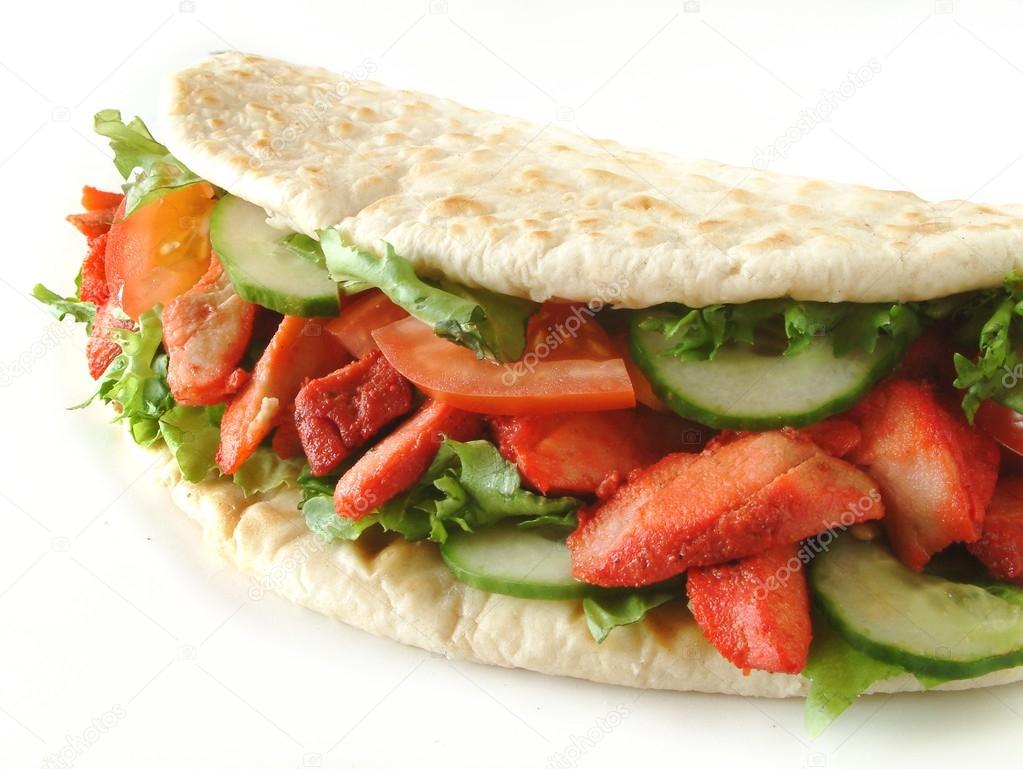 Chicken donner kebab meat wrapped in naan bread