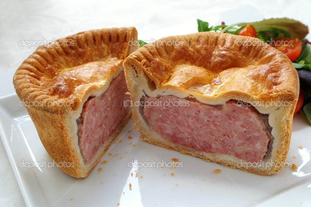 Traditional pork pies on white background
