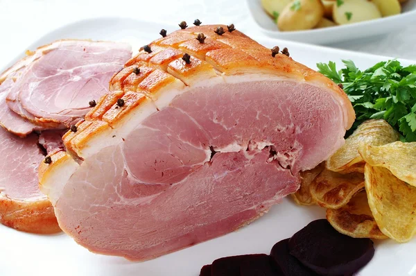 Roast ham joint studded with cloves — Stock Photo, Image