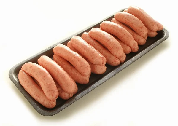 Linked sausages on retail tray — Stock Photo, Image