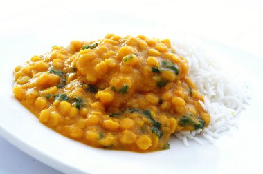 Close up of a plate of tarka dal curry clipart