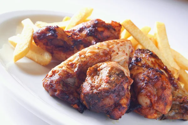Indian style barbecue chicken with potato fries — Stock Photo, Image