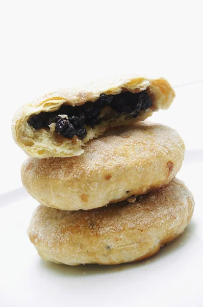 Traditional stacked Eccles cakes on isolated — Stock Photo, Image