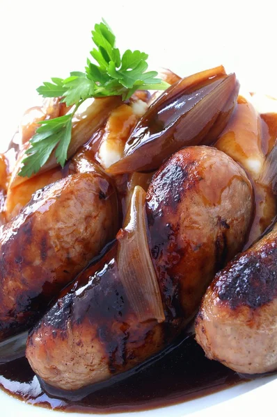 Traditional sausage mash and onion gravy — Stock Photo, Image