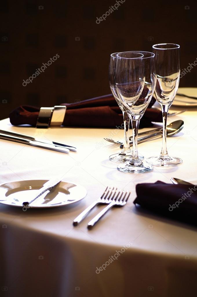 Place setting at laid restaurant banquet table