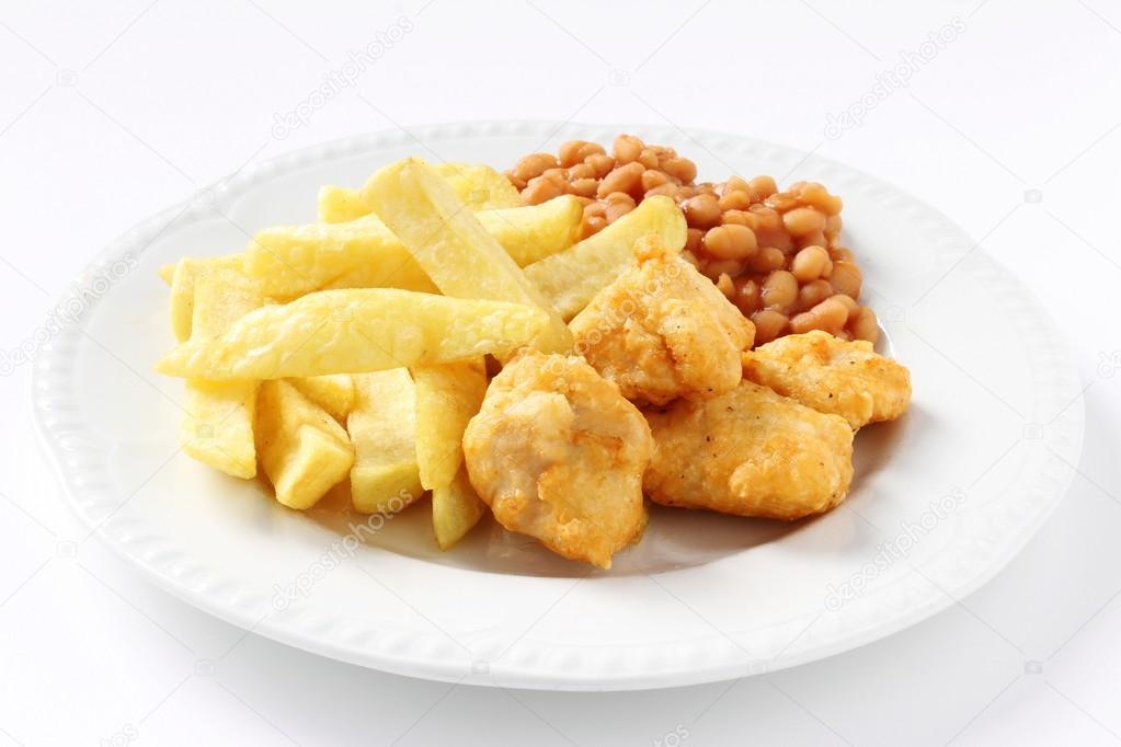 Chicken nuggets and baked beans Stock Photo by ©neillangan 38251703